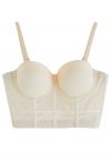 Top corto tipo bustier con aros en color liso en color crema