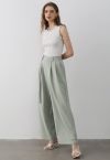 Pantalones palazzo plisados con cintura con cinturón en verde guisante