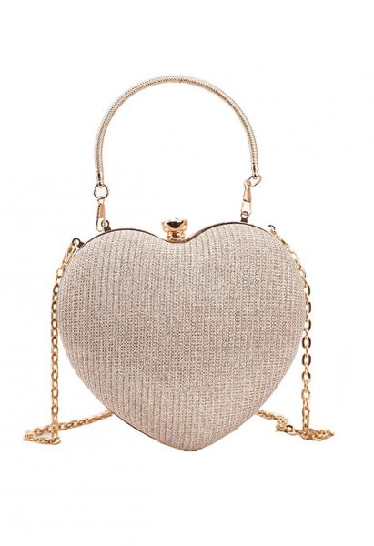 Bolso de mano con forma de corazón reluciente en dorado