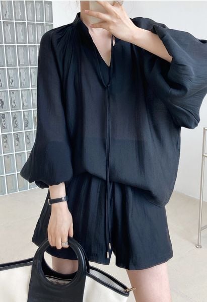 Conjunto negro de camisa con manga farol y pantalón corto acampanado Athleisure