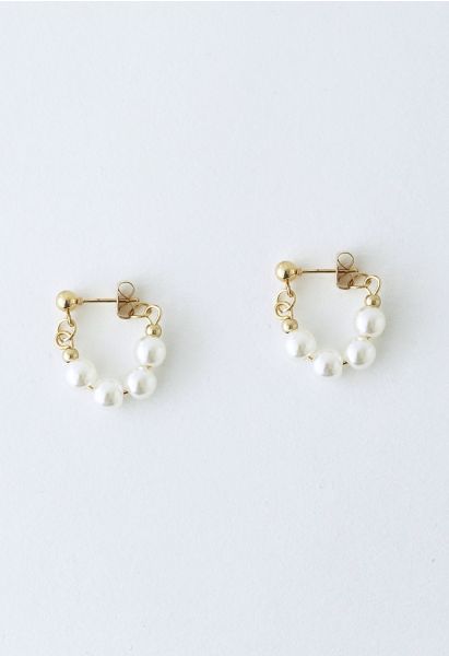 Aretes elegantes con borde de perla