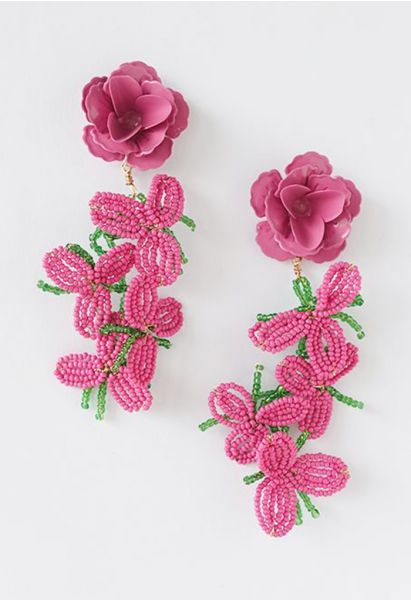 Aretes de flores con cuentas rosadas