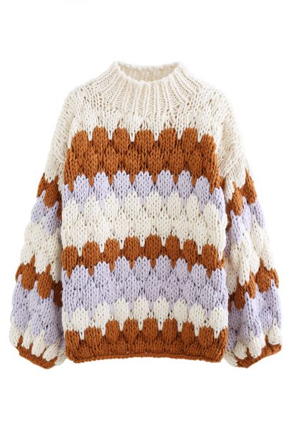 Suéter grueso tejido a mano con cuello alto con bloques de color en color crema