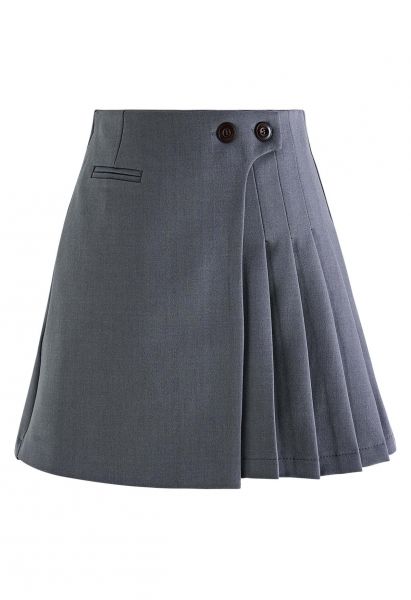 Minifalda con solapa plisada y botones gemelos en gris