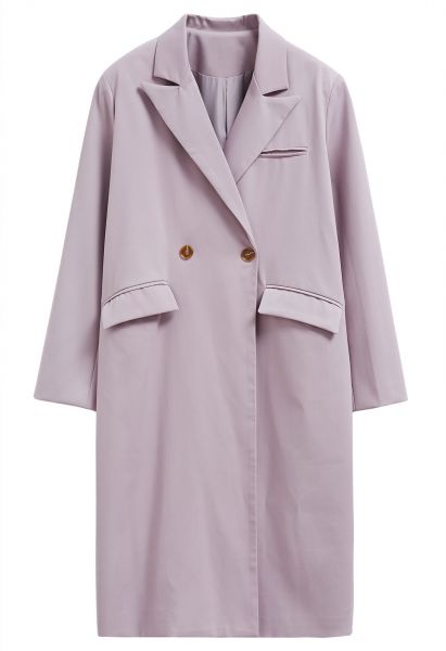 Abrigo largo con cinturón y doble botonadura de moda en rosa