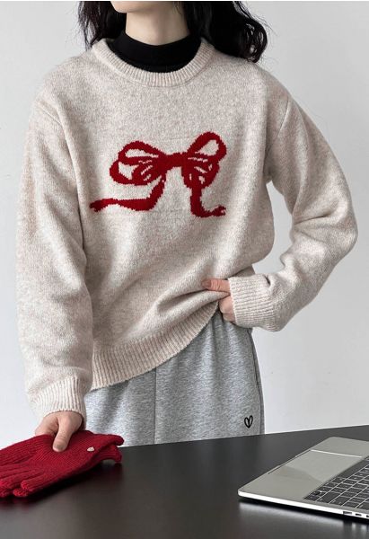 Suéter de punto con borde acanalado y patrón de cinta con lazo