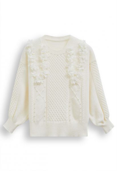 Suéter de punto nacarado con flores 3D en marfil