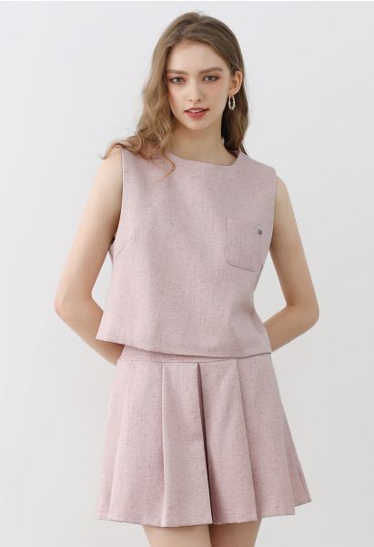 Conjunto elegante de top sin mangas de tweed y minifalda plisada en rosa
