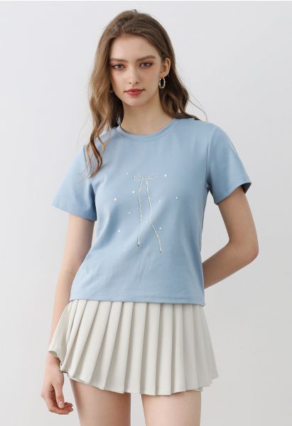 Camiseta de manga corta con estampado de lazo en azul polvoriento