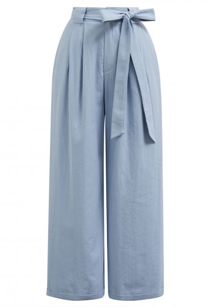 Pantalones anchos plisados con lazo y lazo en azul