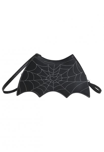 Bolso bandolera con alas de murciélago y estampado de telaraña