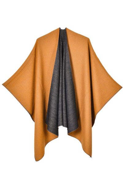 Poncho reversible abierto al frente con dije en color calabaza