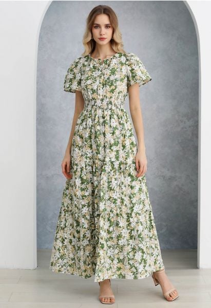 Vestido largo bordado con ojales y estampado de flores exuberantes