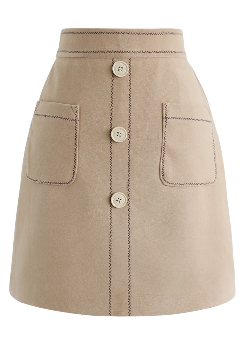 Minifalda con botones y bolsillos en contraste en tostado