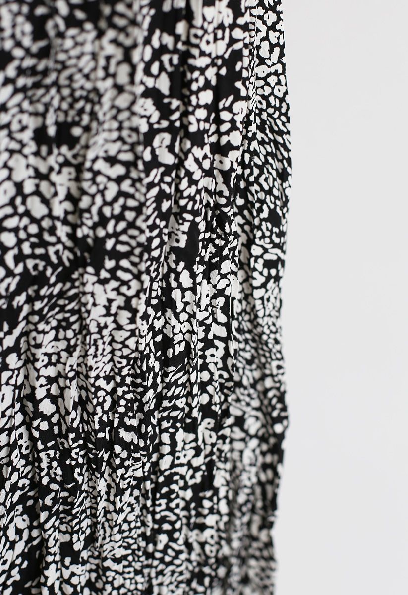 Falda midi plisada con estampado de leopardo en negro