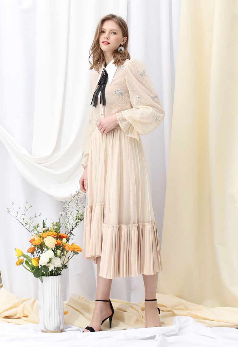 Falda midi plisada con dobladillo asimétrico de malla en color crema