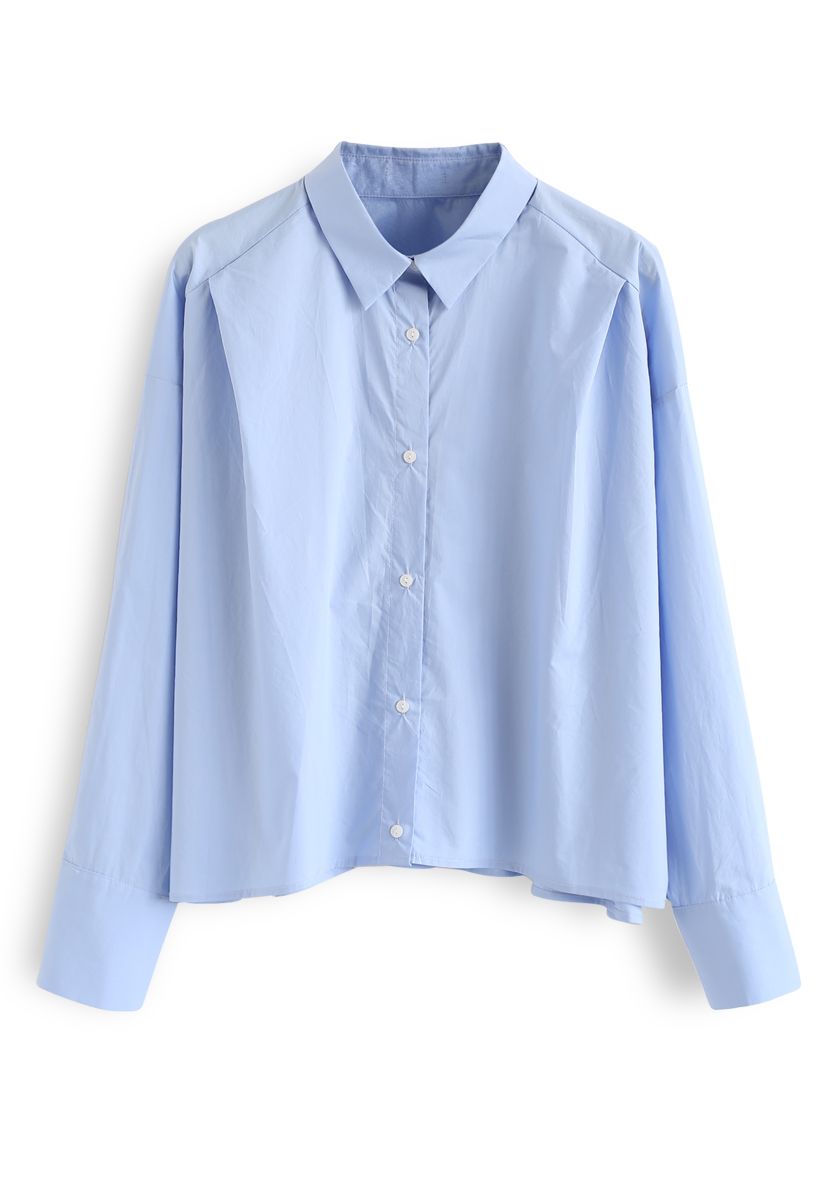 Camisa corta con mangas abotonadas en azul
