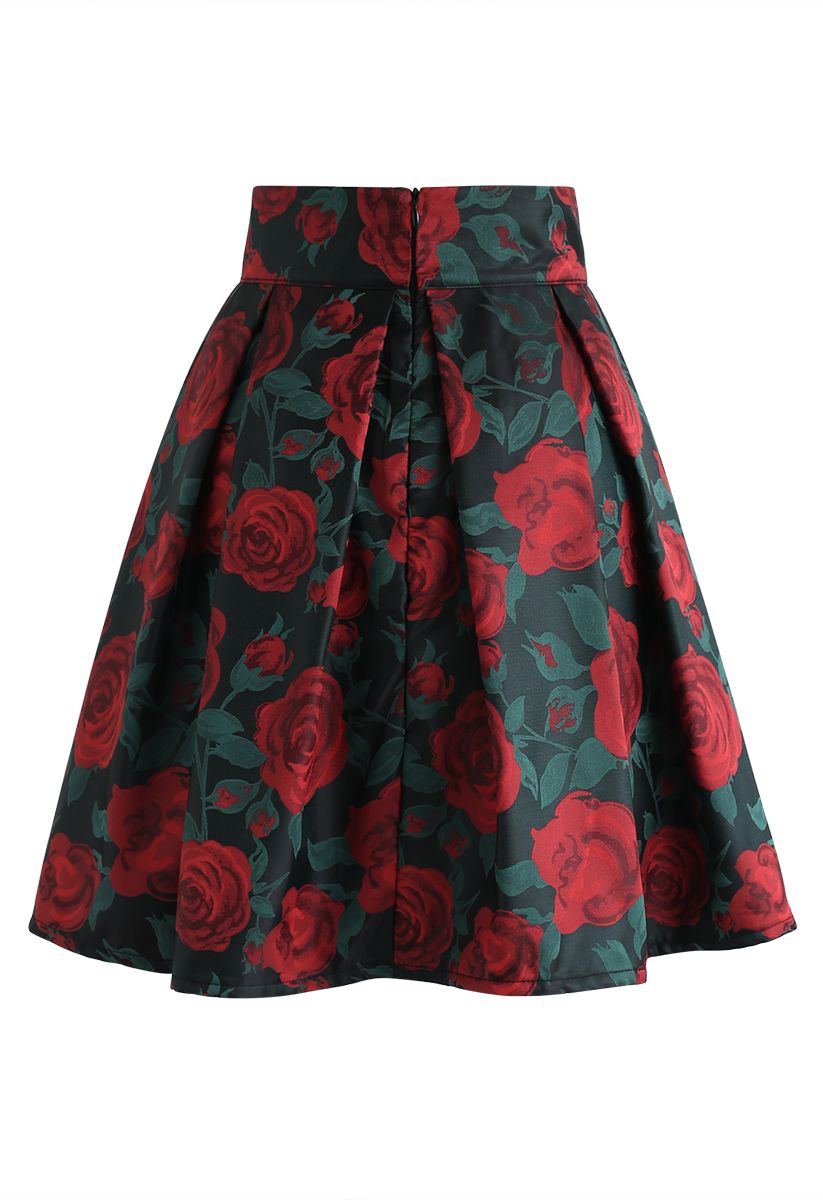 Minifalda plisada con lazo y estampado de rosas rojas