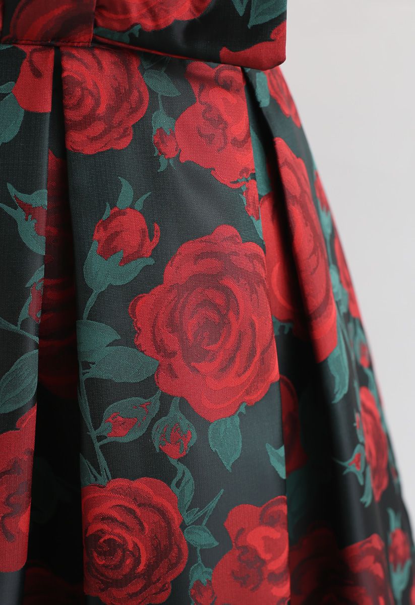 Minifalda plisada con lazo y estampado de rosas rojas