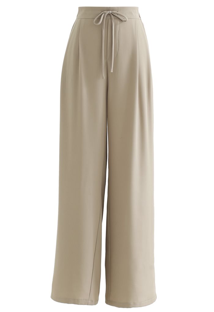 Pantalones anchos de talle alto con cordón en color arena
