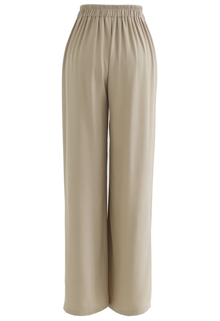 Pantalones anchos de talle alto con cordón en color arena