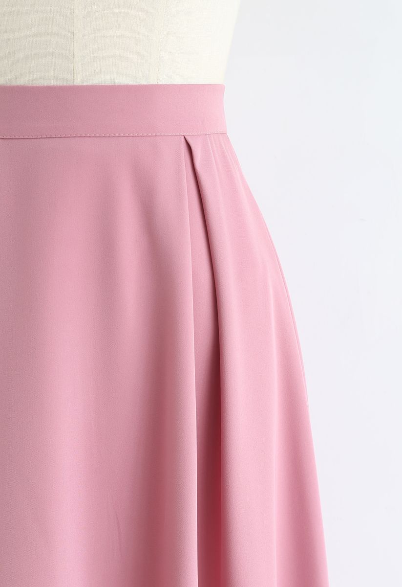 Falda a media pierna plisada con cremallera lateral en rosa