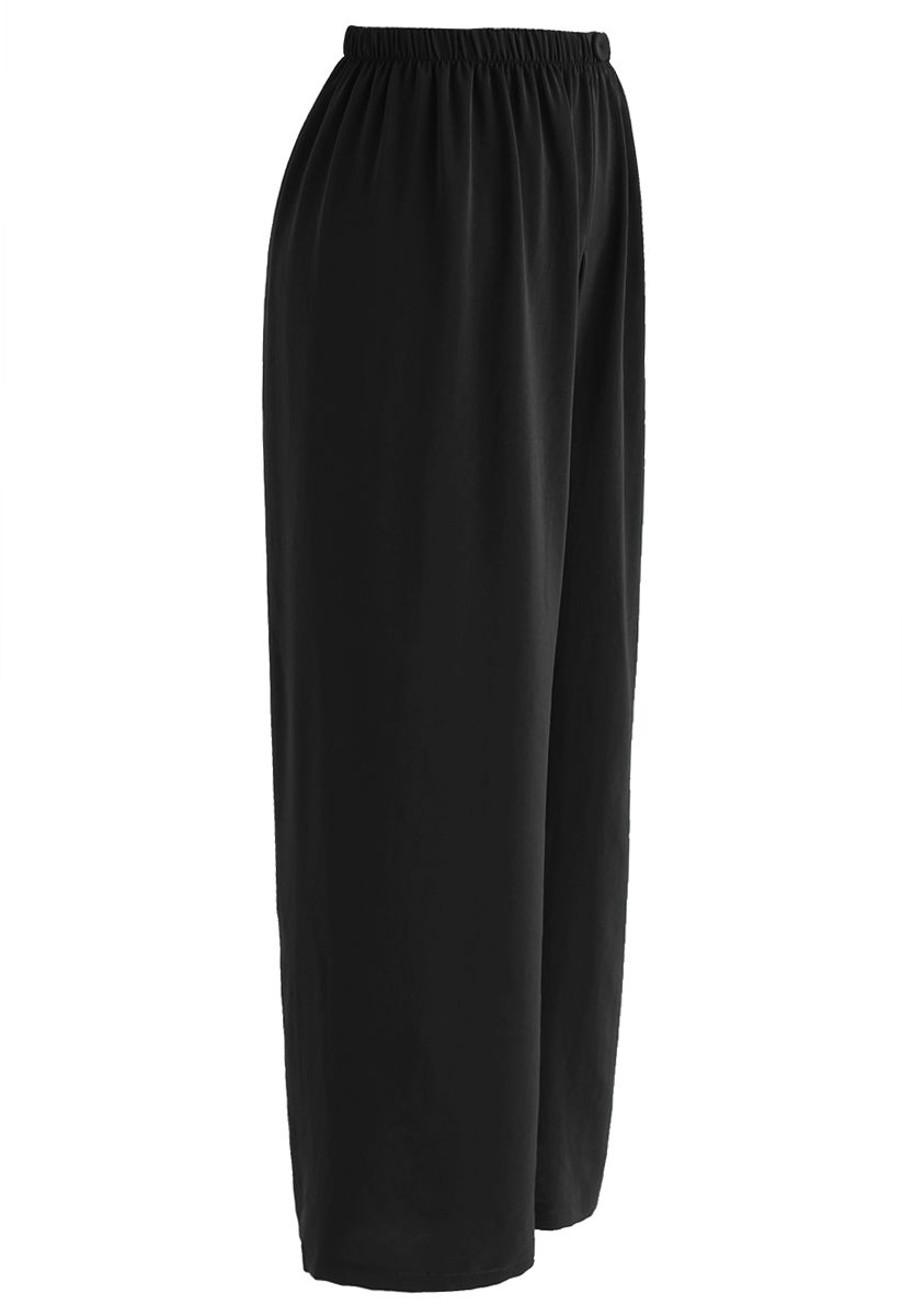 Elegantes pantalones cortos con botones y pernera ancha en negro