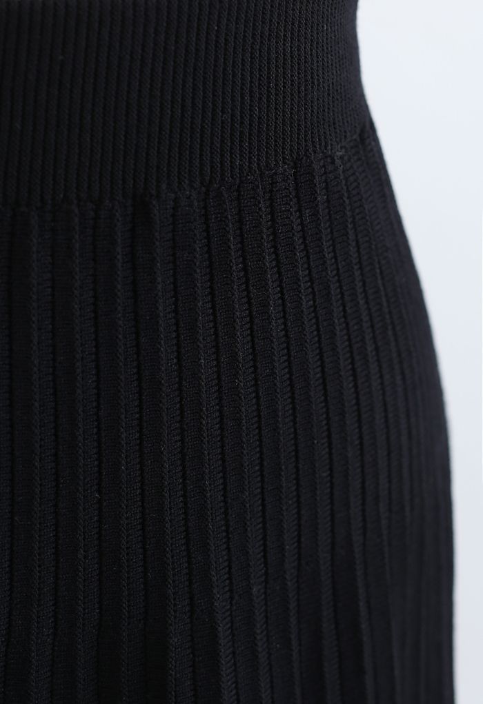 Falda midi de punto plisada con ribete de encaje en negro