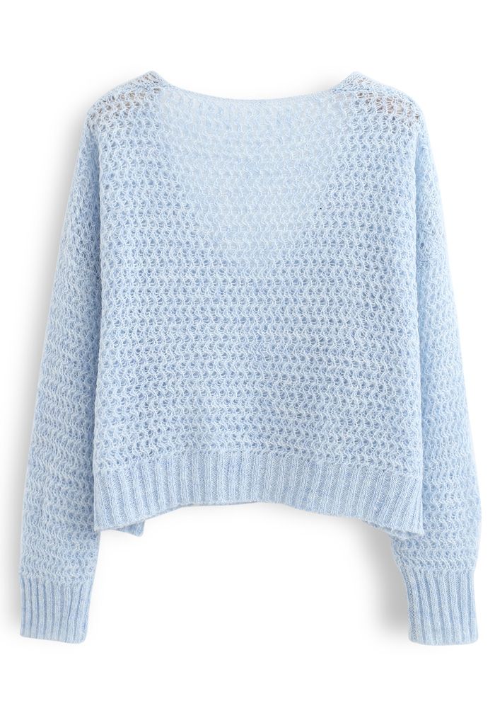 Suéter corto calado de punto esponjoso en azul