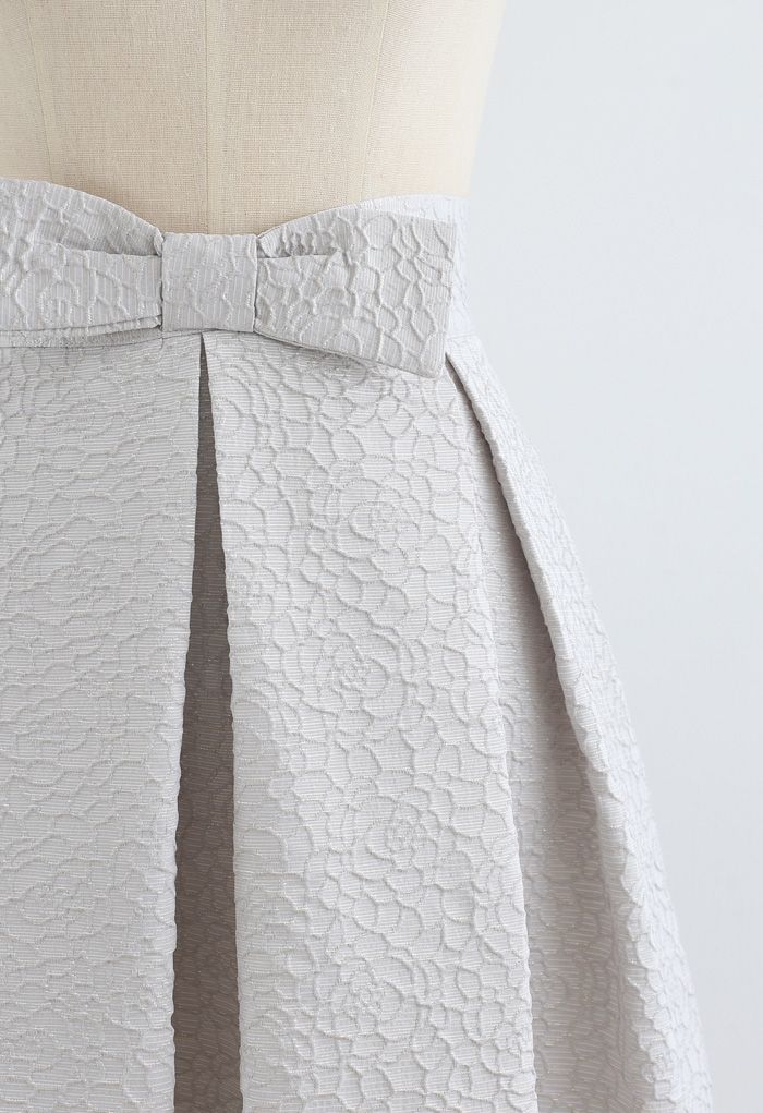 Falda plisada de jacquard floral completo con cintura de lazo en plata