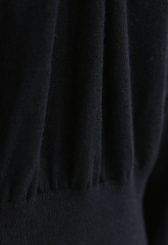 Suéter de punto con cuello drapeado y hombro de malla en negro