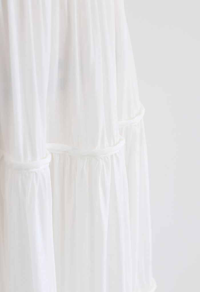 Falda midi plisada con vuelo en blanco