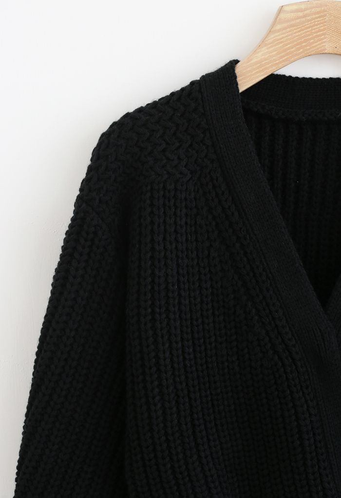 Suéter cruzado de punto grueso con lazo en negro
