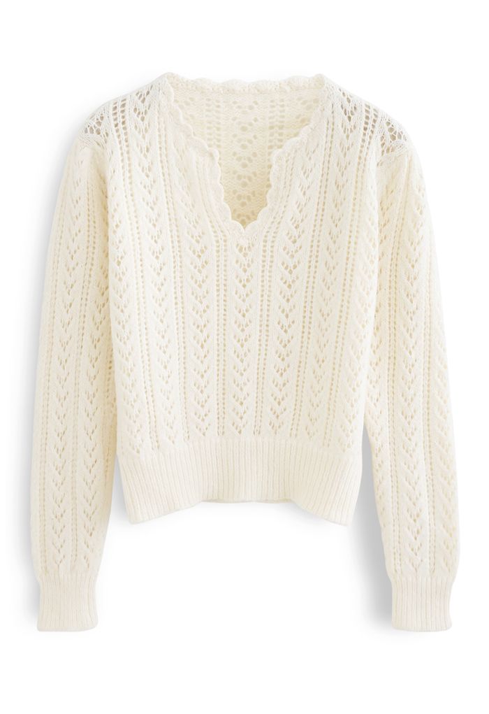 Suéter de punto suave al tacto con cuello en V ahuecado en color crema