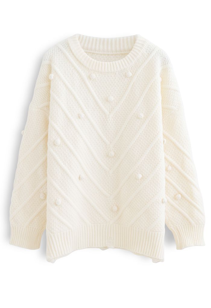 Suéter de punto extragrande con pompones y dobladillo sin rematar en color crema
