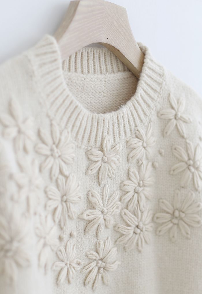 Suéter de punto con mangas abullonadas y flores cosidas