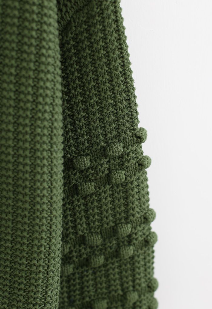 Jersey con mangas de burbujas y detalle de pompones en verde