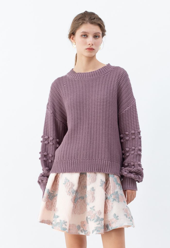 Suéter con mangas de burbujas y detalle de pompones en morado