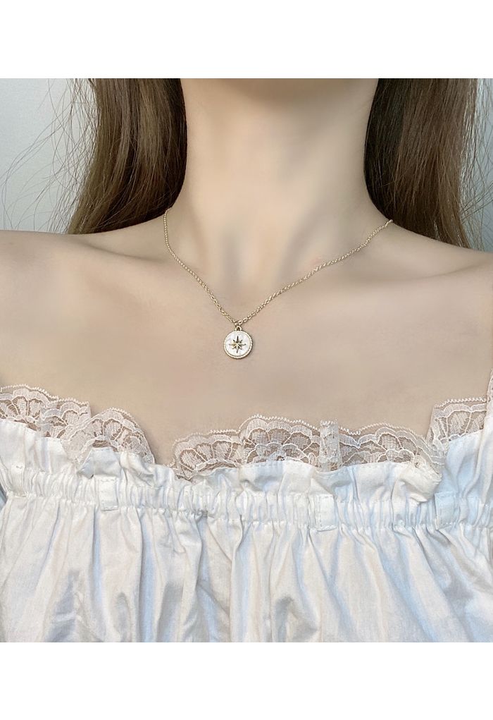 Collar de cadena con moneda de estrella