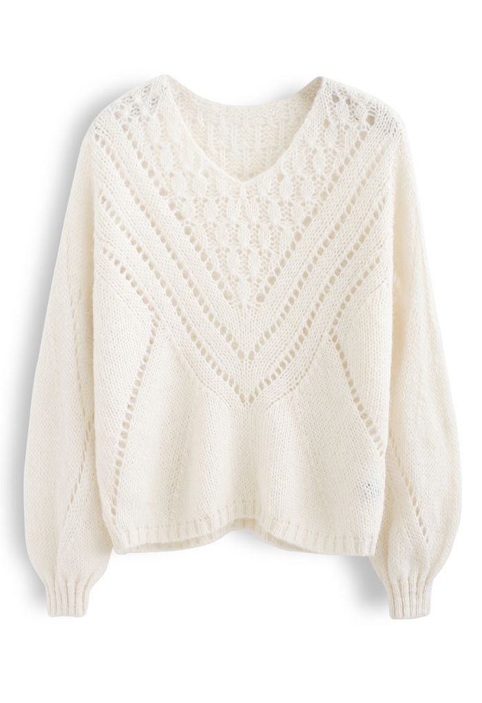 Suéter de punto difuso con ojales en forma de V en color crema