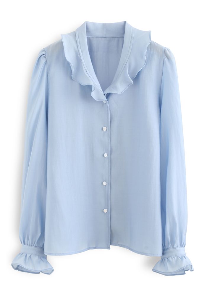 Camisa semitransparente con botones y volantes en azul