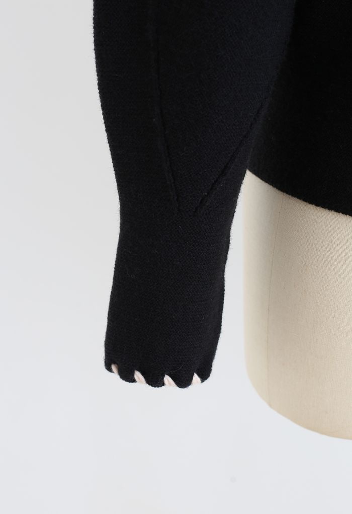 Suéter con mangas abullonadas y lazo en borde trenzado en negro