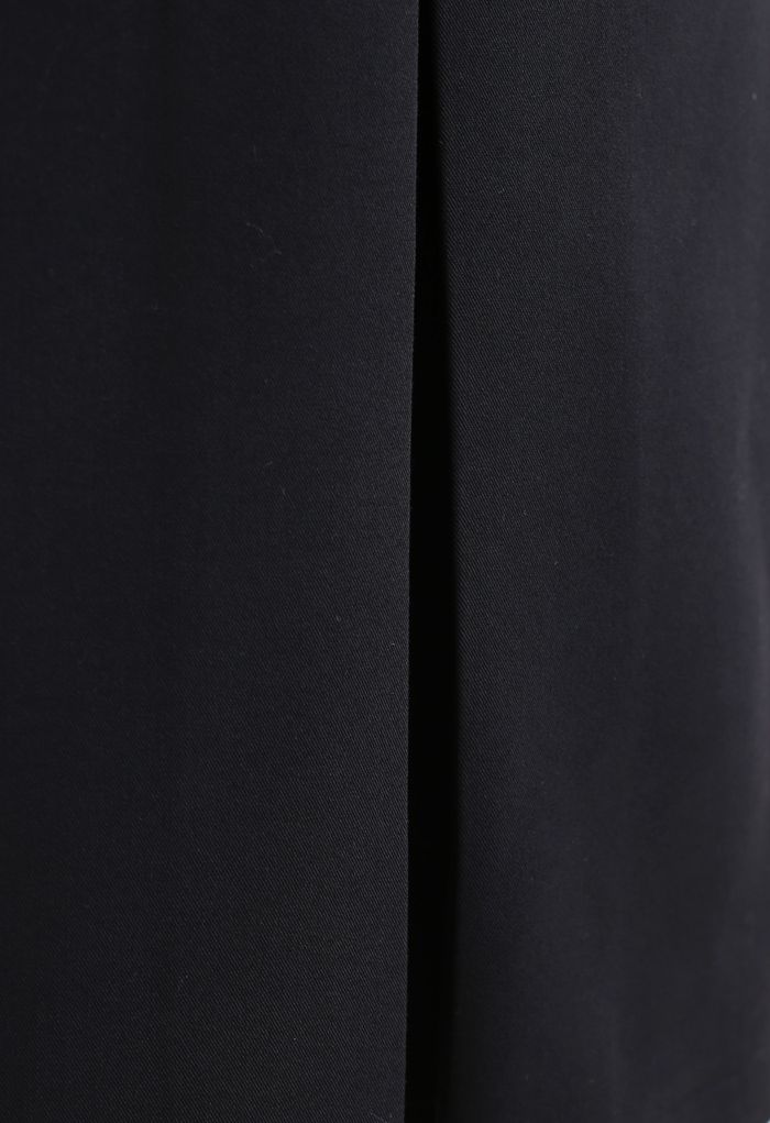 Falda a media pierna con dobladillo plisado en negro