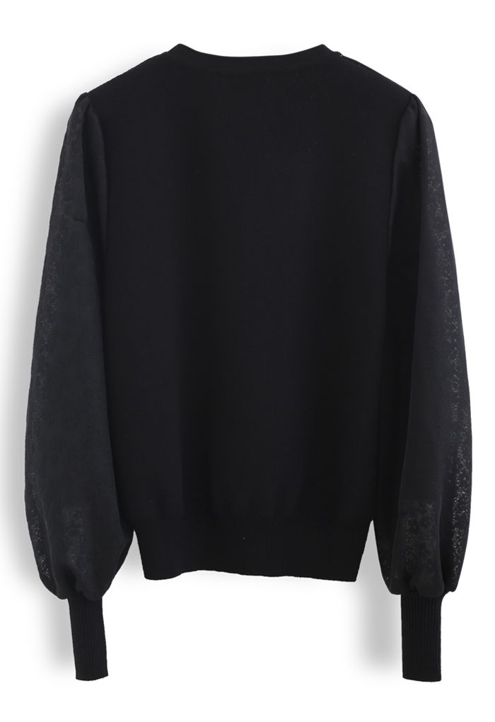 Suéter de punto empalmado con mangas de malla de flores en negro