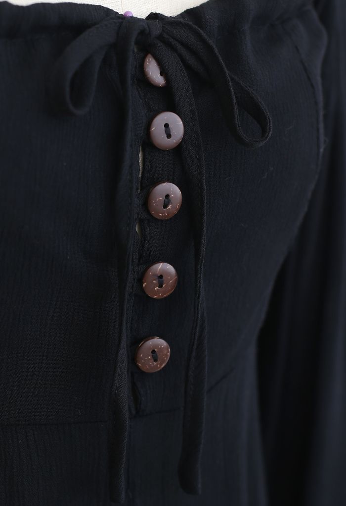 Minivestido asimétrico con cuello cuadrado y botones en negro