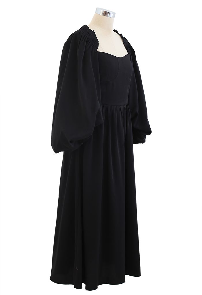 Dramático vestido fruncido con manga abullonada en negro