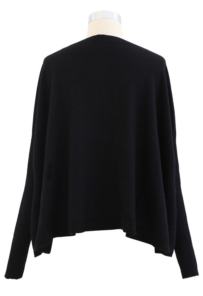 Suéter tipo capa con dobladillo acampanado suave en negro