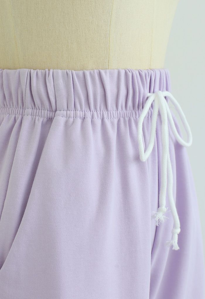 Shorts con bolsillos con cordón y dobladillo doblado en lavanda
