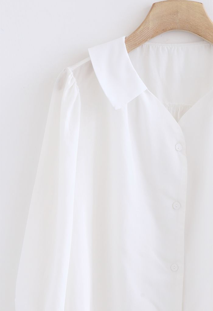 Camisa abotonada de manga tres cuartos en blanco
