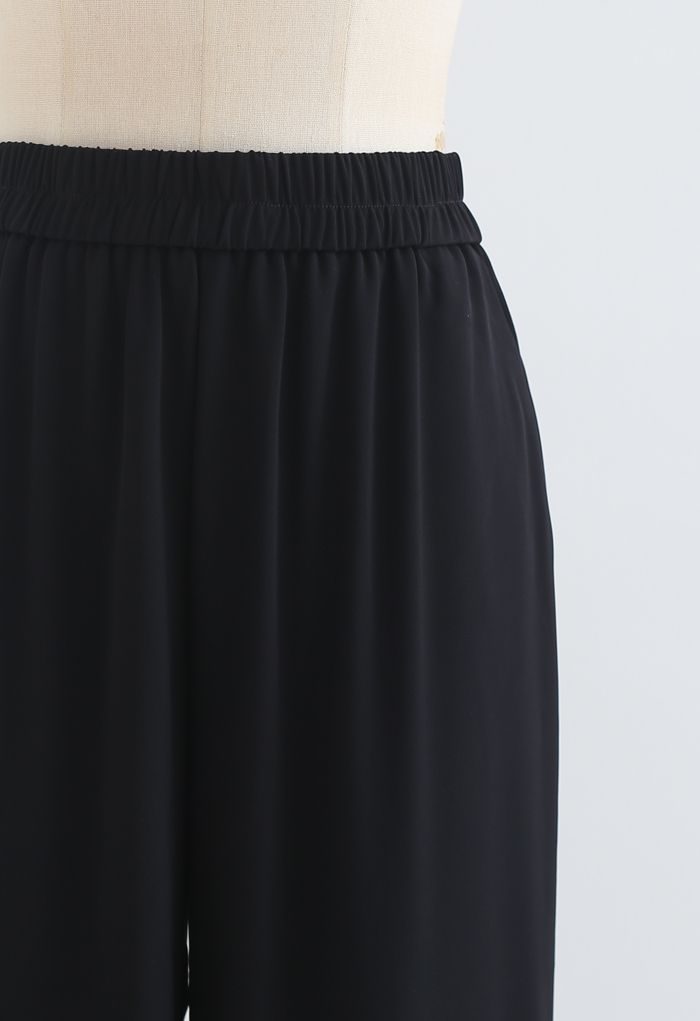 Pantalones rectos con cintura elástica en negro